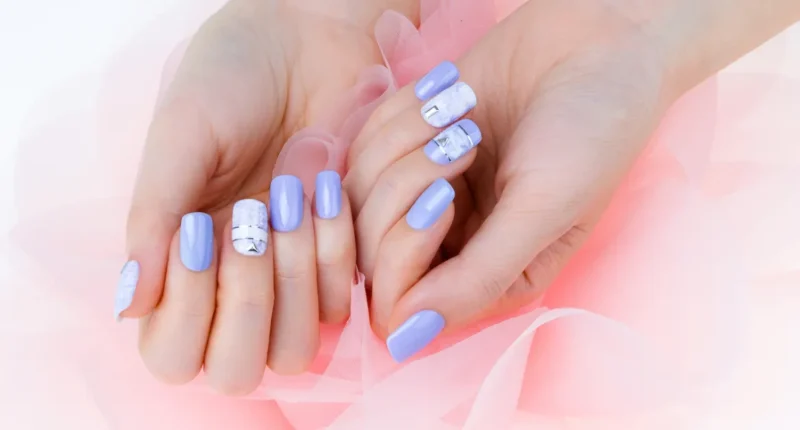 Chic blueberry milk nails with abstract geometric shapes, offering a modern twist on a summer nail trend
